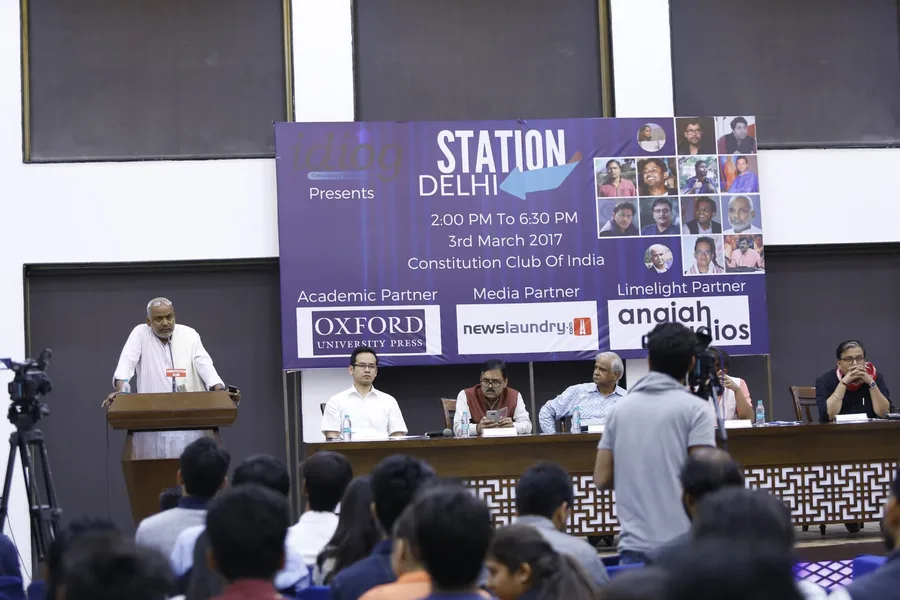 Panel session on stage at a conference produced by Kivashe