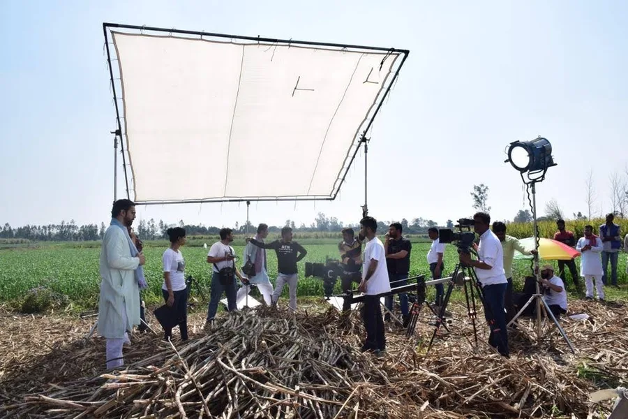 Behind the scenes on a Kivashe film set with lighting rig