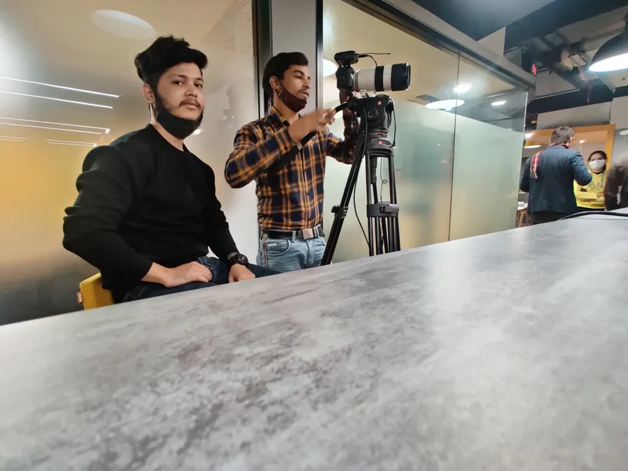 Kivashe crew framing an interview on a cinema camera