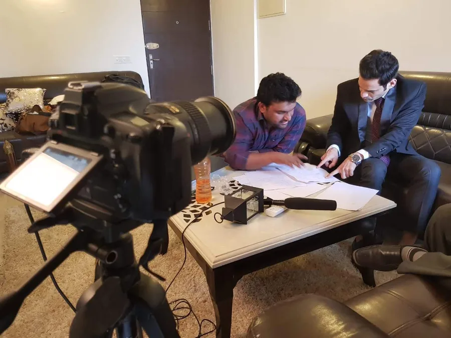 Pre-shoot planning session with a client on camera