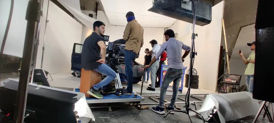 Studio shoot with camera crew on dolly track