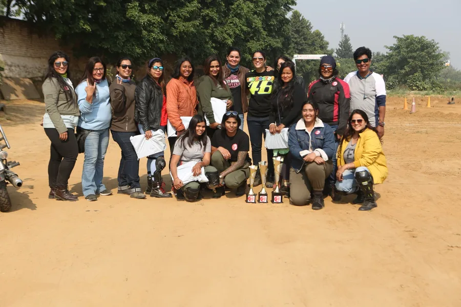 Community riding event coverage with participants and trophies