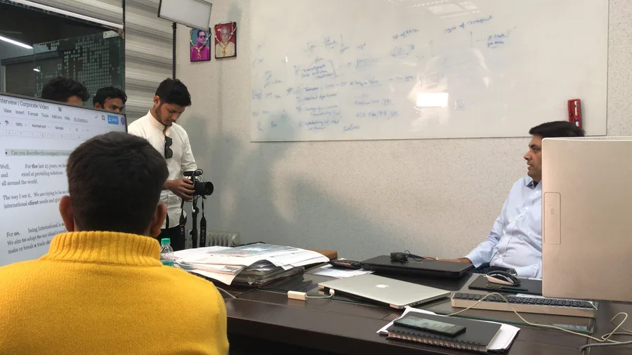 Corporate video interview being recorded in an office